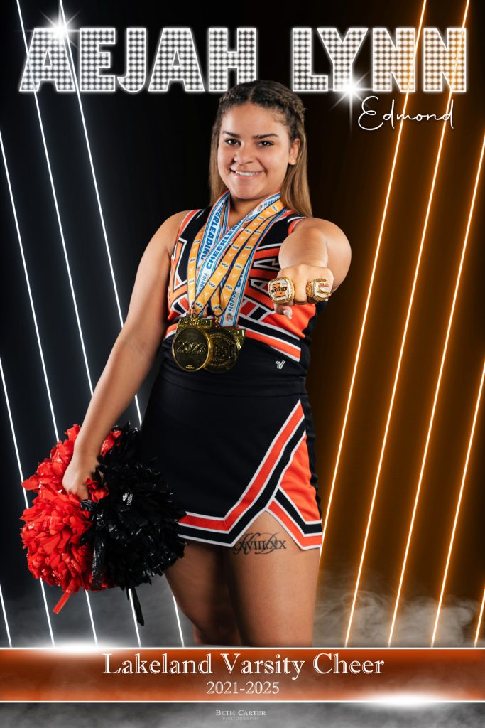 Lakeland high school cheer senior banner featuring chapmionship rings and medals