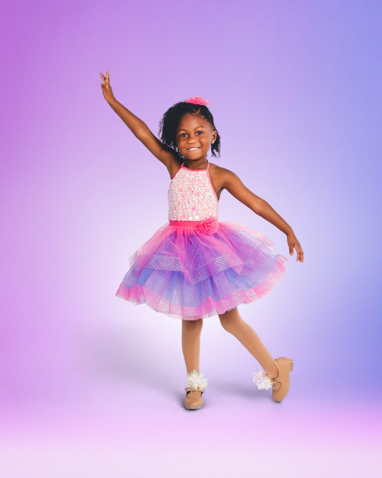 Little girl dancer posing on a digital background in Central Florida