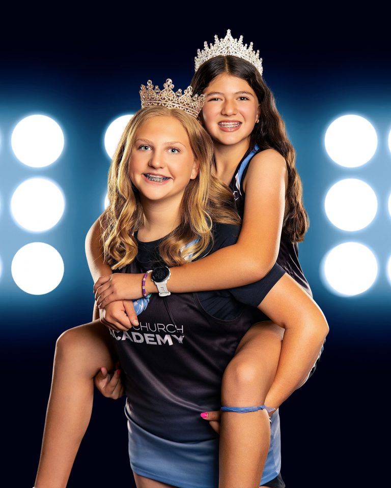 sports buddy photo with girls wearing tiaras on a digital background.
