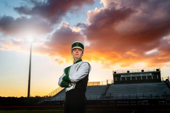 Dramatic off camera lighting of high school drum major at sunset in lakeland, florida