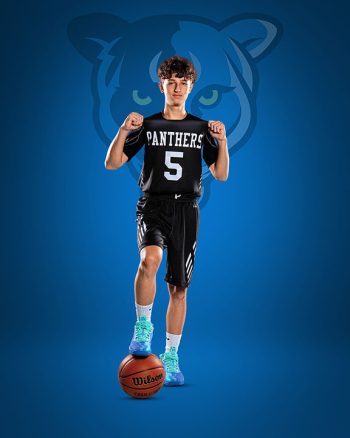 basketball player portrait taken at school sport photo day posing on a digital backdrop