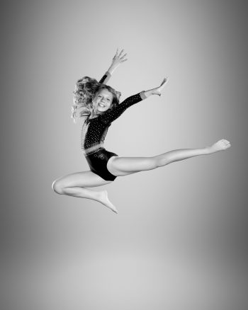 Gymmast leaping at her central florida gymnastics photography session
