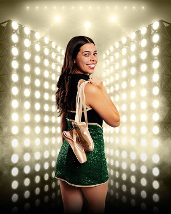 central florida cheer dancer posing for senior banner in her cheer uniform holding ballet shoes taken by bc visuals