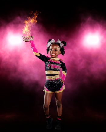 Young all start cheerleader on a dramatic lighting digital background in lakeland, florida