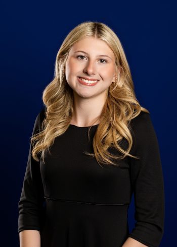 Central Florida chorus headshot taken on a traditional blue studio backdrop