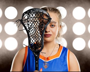 headshot of female lacrosse player taken on promod digital background during high school media day