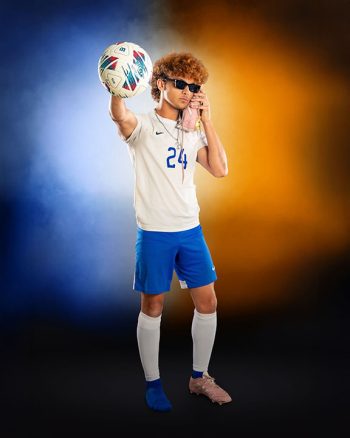 central florida soccer player on media day posing with shoe and ball on a digital background