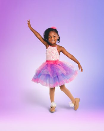 Little girl dancer posing on a digital background in Central Florida