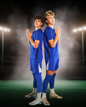 two high school athletes posing for a buddy picture at school photo day