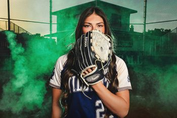 lakeland, florida softball player portrait on the field with dramatic smoke and green lighting