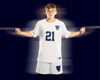 school soccer player portrait using a ghost filter on a simple studio background