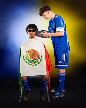 2 Auburndale soccer players posing like they are at a barber shop for sports media day