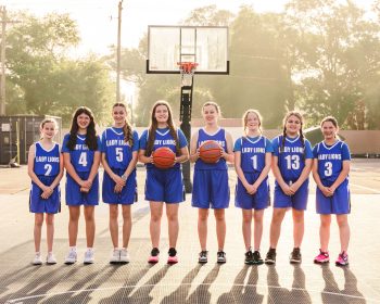 outdoor girls basketball team photo taken on outdoor court in Lakeland, fl