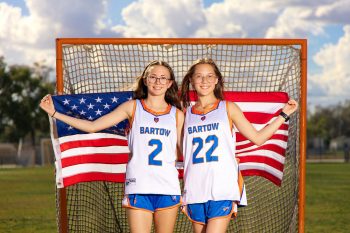 Buddy pose with american flag taken at a lacrosse media day in bartow, florida