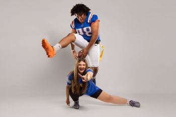 boyfriend football player and girlfriend flag football player posing in the BC Visuals photography studio