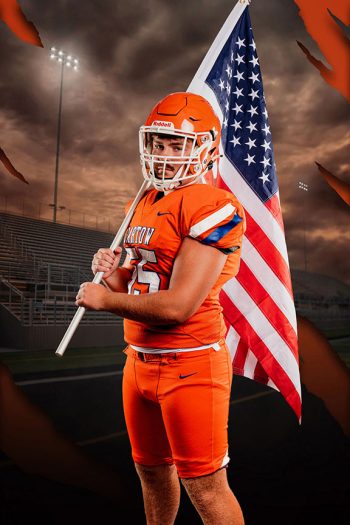 bartow, florida football player holding an American flag taken at a high school media day.