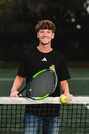 auburndale, florida high school tennis player portrait taken on the tennis courts with off camera lighting