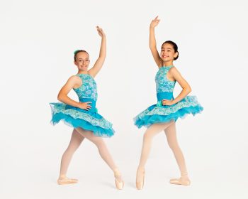 Two ballerinas posing on photo day at a central florida dance studio.
