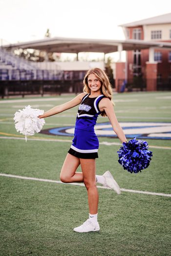 lakeland, florida cheerleader on a football field with natural light