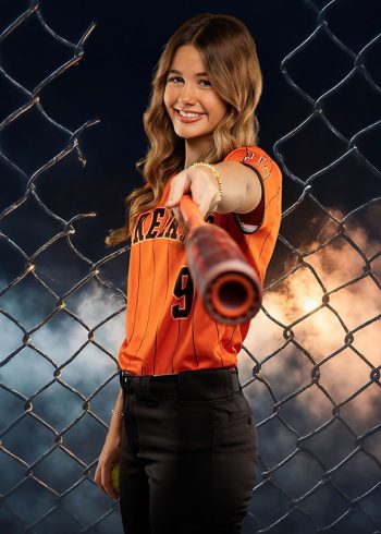 softball player in front of a digital chain link fence in central florida
