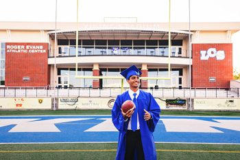 senior photo shoot on school football field using natural light
