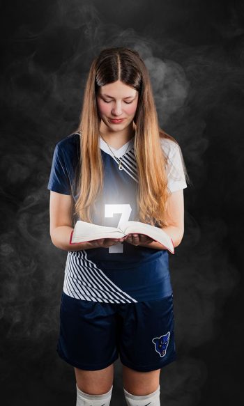 bc visuals portrait of player holding a bible