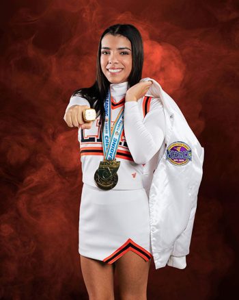 lakeland, florida cheerleader posing with jacket and championship ring on a digital background