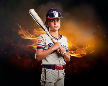 young travel ball baseball player in front of digital background with flames